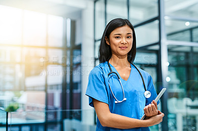 Buy stock photo Portrait of a young nurse standing in a hospital