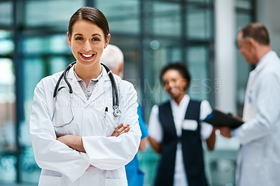Buy stock photo Healthcare, happiness and portrait of woman doctor with confident smile in hospital for leadership in medicine. Health care career, wellness and medical professional with mockup in lobby of clinic.