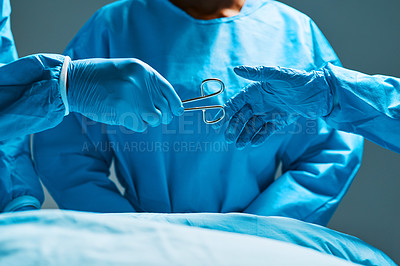 Buy stock photo Surgery, teamwork and hands of doctor with scissors for healthcare, assistance and focus on professional medicine. Medical innovation, tools and surgeon with expert staff in hospital operating room.