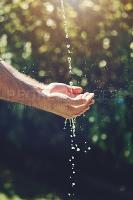 Buy stock photo Water, wellness and hydration with a person washing hands outdoor in nature for life, sustainability or moisture. Environment, splash and wet with an adult cleaning outside for wellness or hygiene
