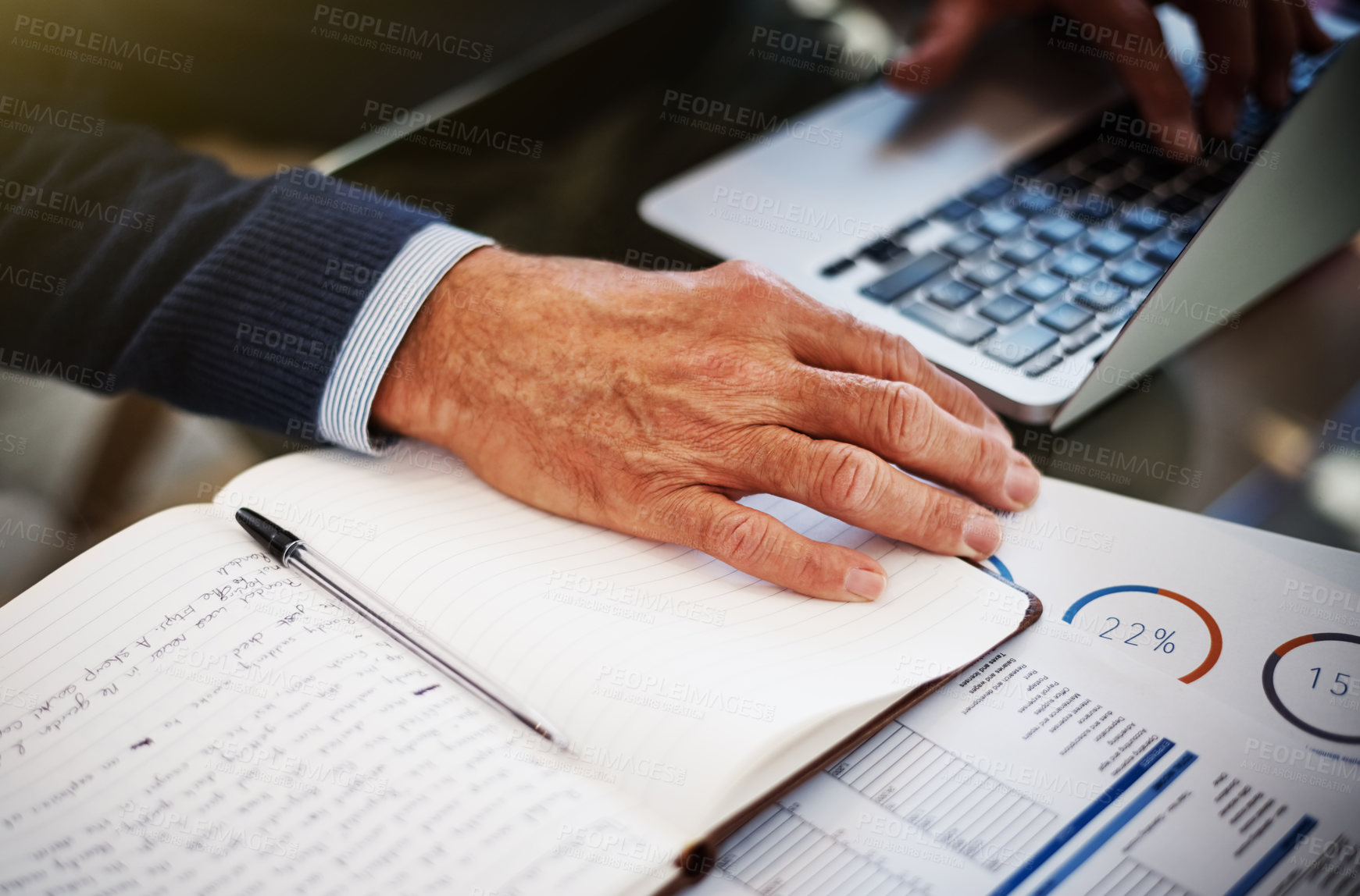 Buy stock photo Cropped shot of a businessman using a laptop at his work desk