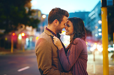 Buy stock photo Couple, night and city with hug for bonding, romance and love in relationship with life partner. Happiness, affection and people with commitment and trust, sweet moment and romantic together outdoor