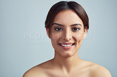 Buy stock photo Portrait, beauty and skincare of happy woman with glow, aesthetic or clean isolated on blue studio background. Face, makeup and model in facial cosmetic treatment for shine, dermatology and results