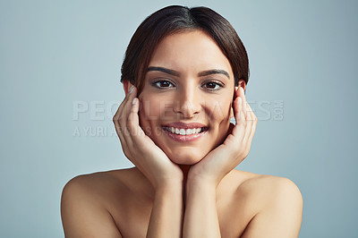 Buy stock photo Portrait, cosmetics and skincare of happy woman with glow, clean or aesthetic. Touch face, makeup and model in facial treatment for beauty, dermatology and hydration results on blue studio background