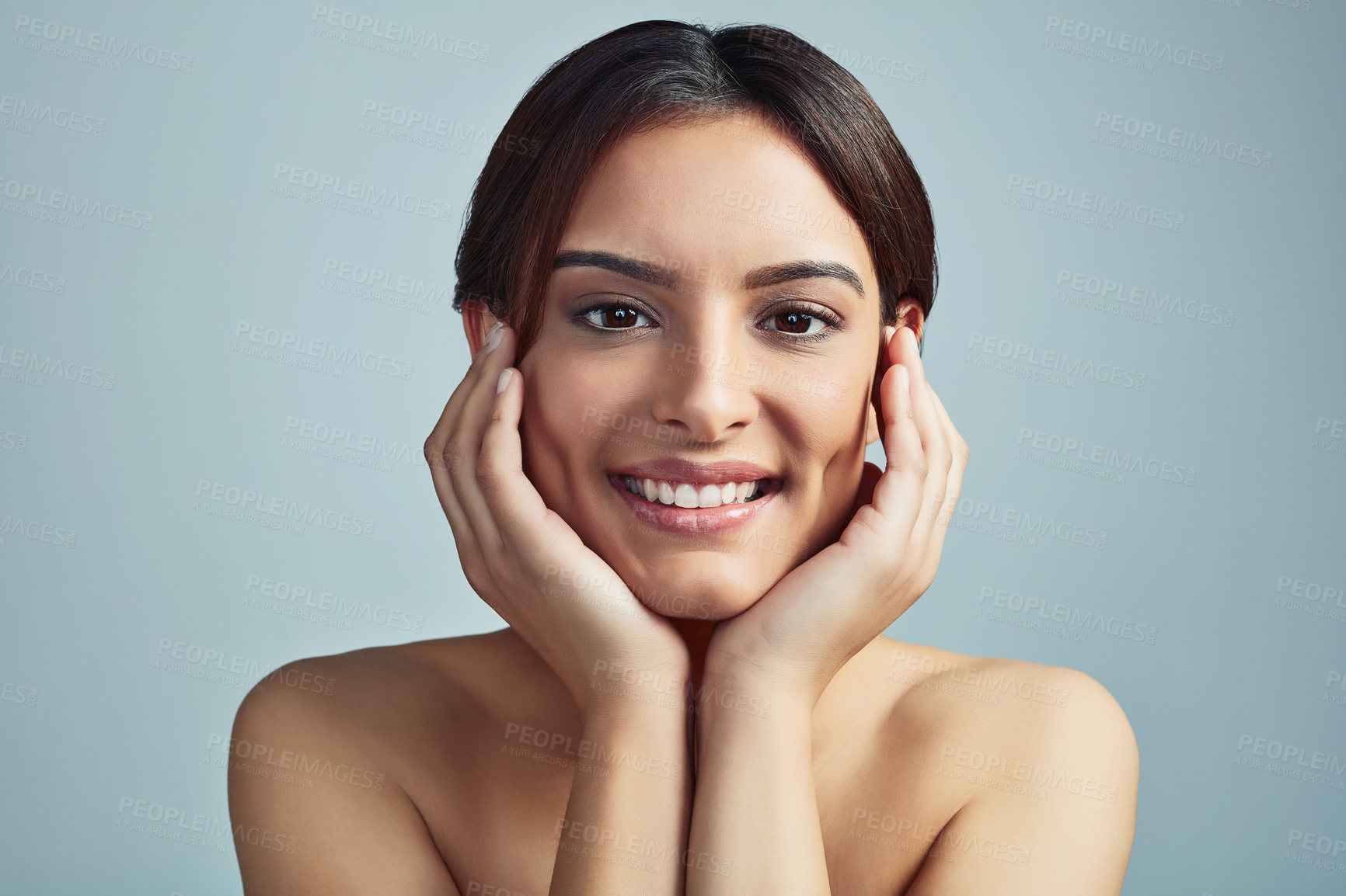 Buy stock photo Portrait, cosmetics and skincare of happy woman with glow, clean or aesthetic. Touch face, makeup and model in facial treatment for beauty, dermatology and hydration results on blue studio background