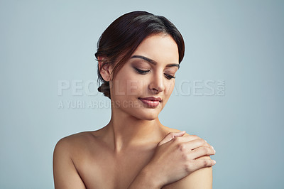 Buy stock photo Touch, beauty and skincare of woman with glow, aesthetic and clean isolated on blue studio background. Face, makeup and model in cosmetics treatment for shine, hydration and dermatology for results