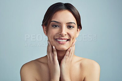 Buy stock photo Portrait, cosmetics and skincare of happy woman with beauty, clean or aesthetic. Touch face, makeup and model in facial treatment for shine, dermatology or hydration results on blue studio background