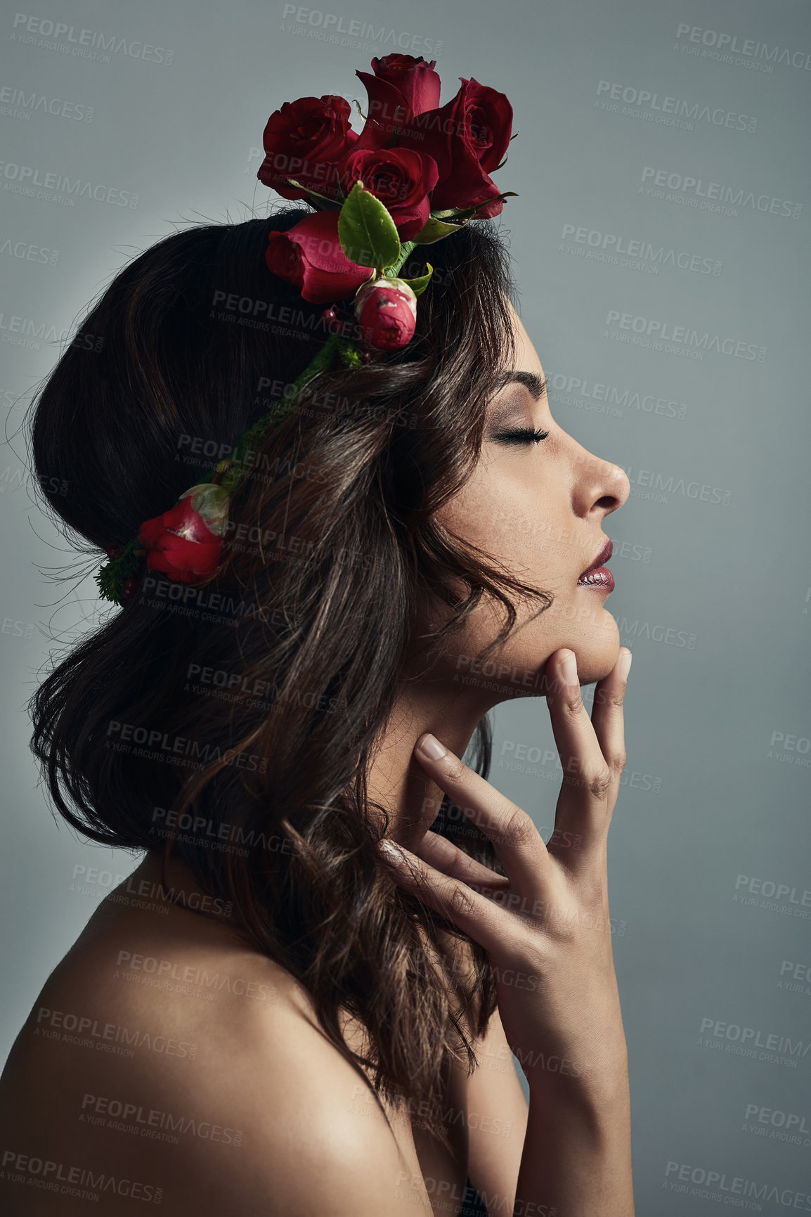 Buy stock photo Profile, wreath and woman in studio, roses and fantasy with floral, skincare and sustainability. Grey background, proud and glow of skin with treatment, flowers and natural cosmetics with dermatology