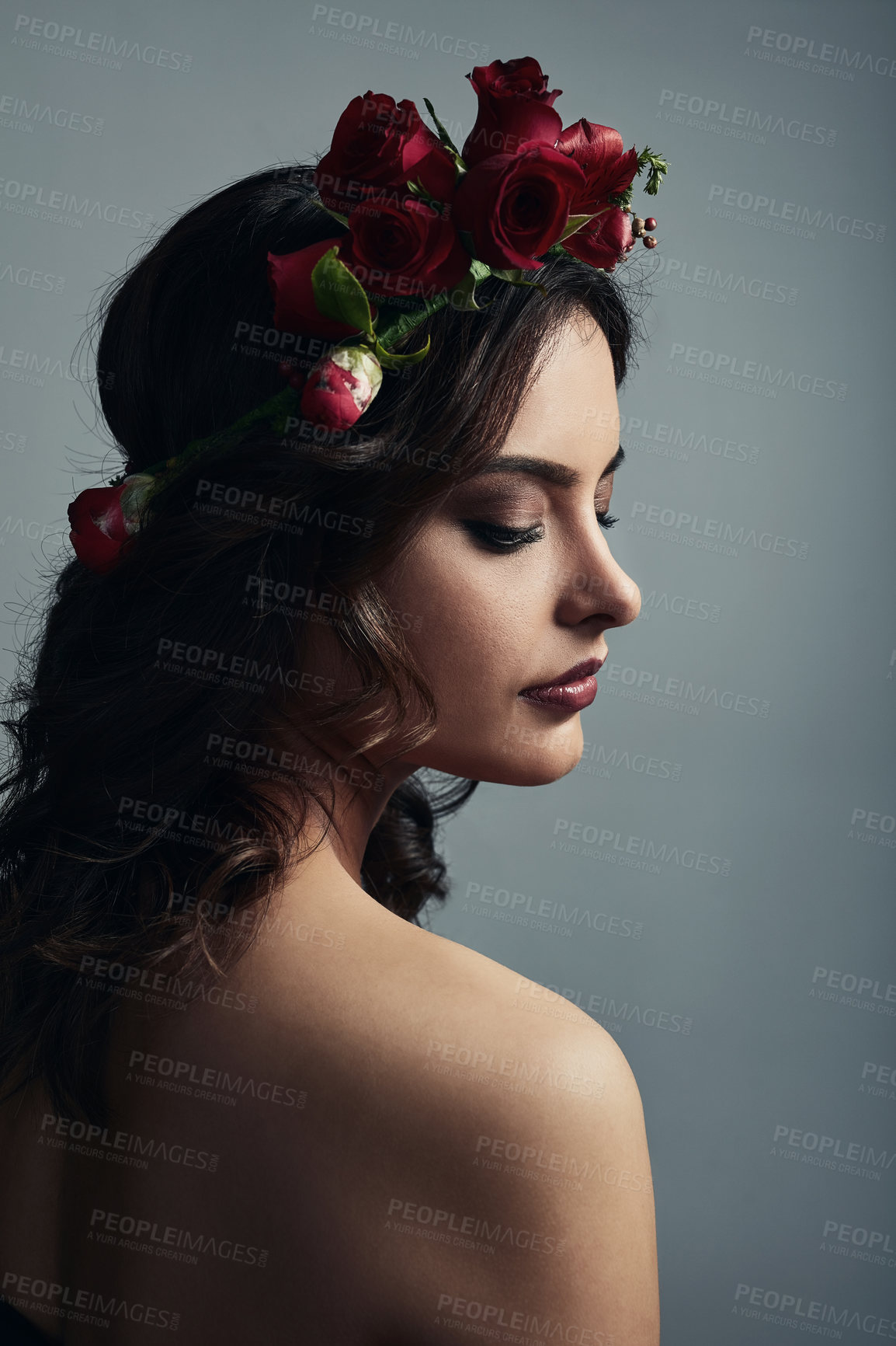 Buy stock photo Thinking, glow and woman with flowers, skincare and fantasy with floral, dermatology and studio. Grey background, proud and shine of skin with treatment, wreath and natural cosmetics with roses