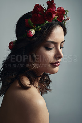 Buy stock photo Thinking, flowers and woman in studio, skincare and fantasy with floral, dermatology or sustainability. Grey background, proud and glow of skin with treatment, wreath or natural cosmetics with roses