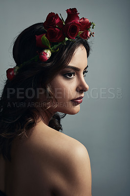 Buy stock photo Thinking, cosmetics and woman with flowers, skincare and fantasy with floral, dermatology and studio. Grey background, proud and shine of skin with glow, wreath and treatment with roses and makeup