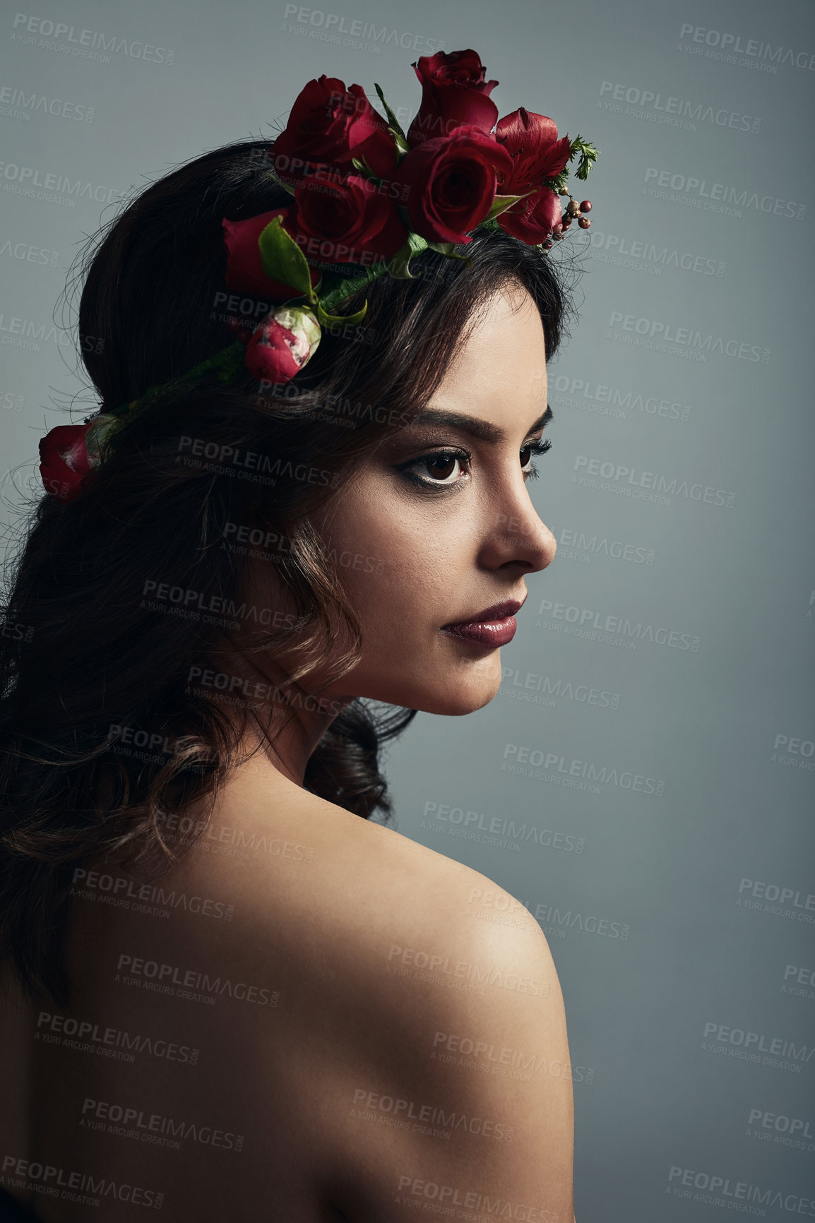 Buy stock photo Thinking, cosmetics and woman with flowers, skincare and fantasy with floral, dermatology and studio. Grey background, proud and shine of skin with glow, wreath and treatment with roses and makeup