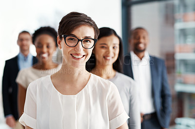 Buy stock photo Portrait of a diverse team of professionals standing together in an office