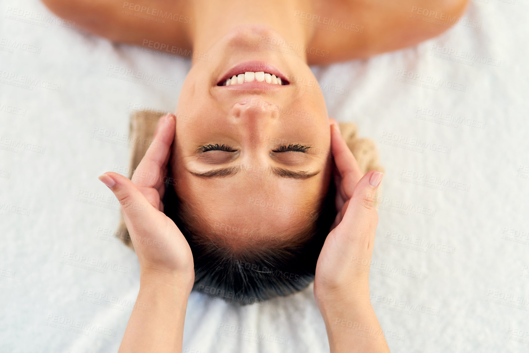 Buy stock photo Face, head massage and smile with woman in spa to relax as customer for hospitality or wellness. Happy, holistic or peace with client and masseuse in luxury hotel for detox, retreat or treatment