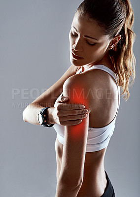 Buy stock photo Sports injury, woman and hand on arm with red glow for fitness, workout and gym in studio. Shoulder tear, pain and athlete with muscle for training, exercise and motivation on gray background