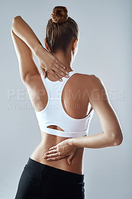 Buy stock photo Woman, studio and athlete with back pain from workout with exercise for fitness with injury. Stretch, sports and health with bruise or sprain from running for anatomy with wellness and tension