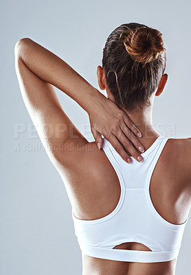 Buy stock photo Sports injury, woman and back pain for fitness, workout and wellness in studio. Hurt, athlete and thoracic spine with stress for training, exercise and uncomfortable strain on gray background