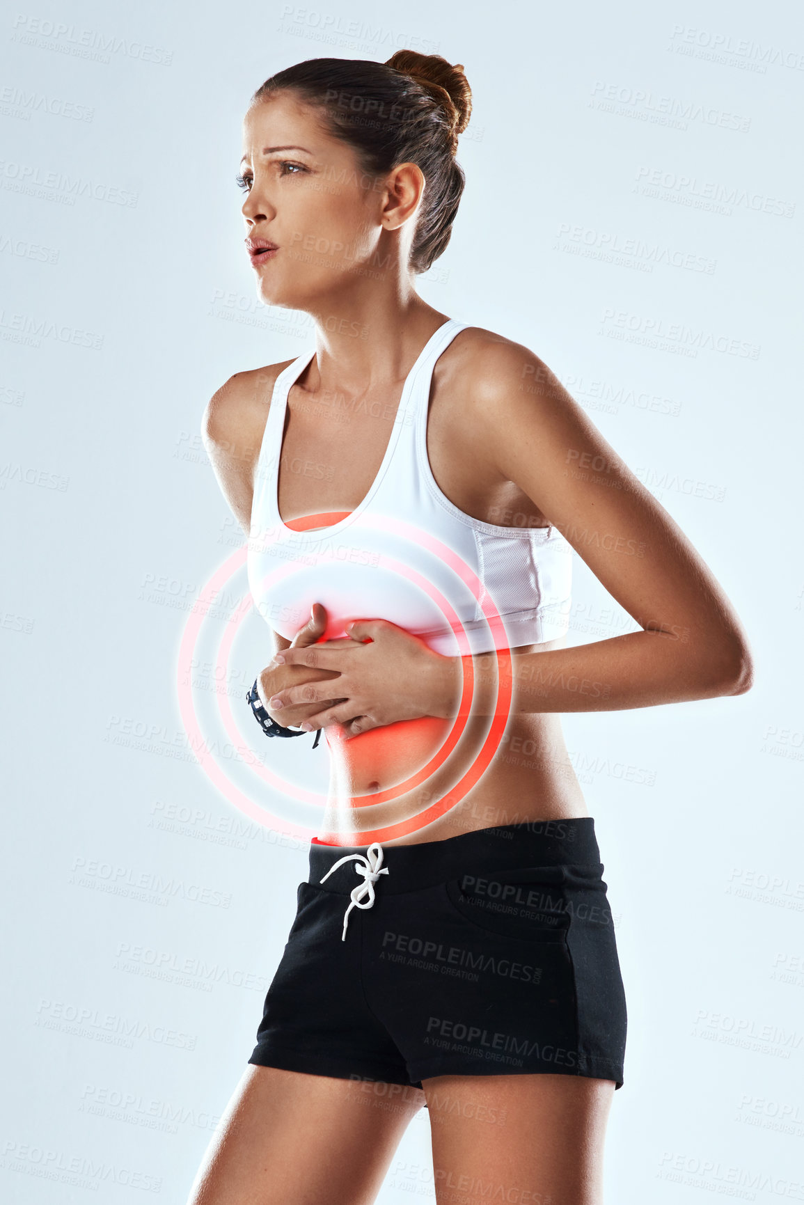 Buy stock photo Fitness, stomach pain or injury with woman and red glow for constipation, tension and IBS with cramps on white background. Exercise, athlete and anatomy overlay, gut health and digestion issue