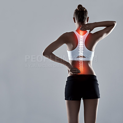 Buy stock photo Fitness, injury and back pain, woman and red glow for spine x ray or bone isolated on grey background. Exercise, athlete and anatomy overlay with inflammation, muscle or tendon tension in studio