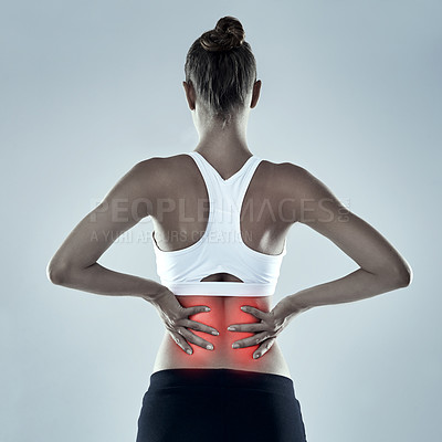 Buy stock photo Exercise, injury and back pain, woman and red glow for spine x ray or bone isolated on grey background. Fitness, athlete and anatomy overlay with inflammation, muscle or tendon tension in studio