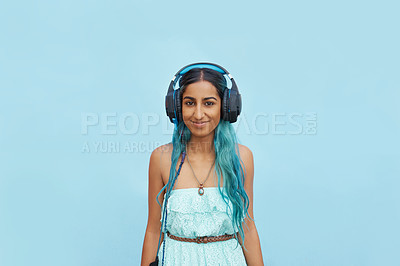 Buy stock photo Headphones, music and portrait of girl in studio with smile for audio streaming, online radio or podcast. Indian student, mockup and person with tech for sound, media or connection on blue background
