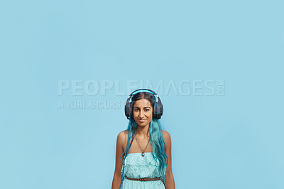 Buy stock photo Woman, headphones and portrait with music, mockup space and blue wall background on campus. Student, face and podcast audio or radio for education, college and confidence for university break