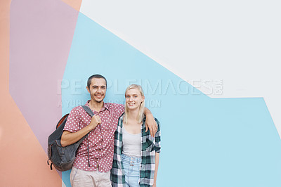 Buy stock photo Couple, students and happy portrait in studio for higher education or knowledge, hug and bonding for love. People or gen z friends, color block and scholarship for university, college and tourism.