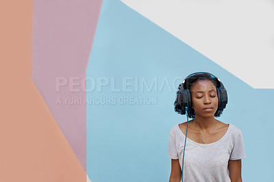 Buy stock photo Black woman, headphones and student for streaming music, audio podcast or listening to radio on campus. Color block, technology and person with headset for peace, relax and entertainment at college