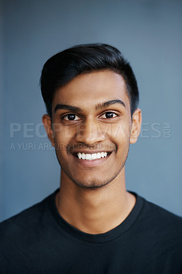 Buy stock photo Studio, portrait and smile of Indian student, happiness and confidence with tshirt, fashion and college. University, gen z and male person, guy and background, pride and face of model and stylish