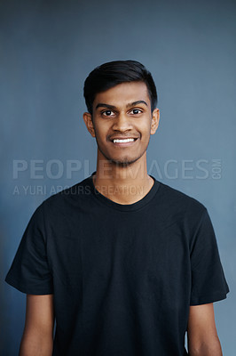 Buy stock photo Studio, portrait and happiness of Indian student, guy and confidence with t-shirt, fashion and college. University, gen z and male person, smile and background, pride and face of model and stylish
