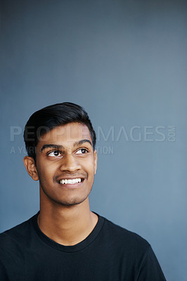 Buy stock photo Thinking, smile and Indian man in studio for problem solving, brainstorming or solution on grey background. Idea, planning and gen z student with why, questions or reflection, memory or conclusion