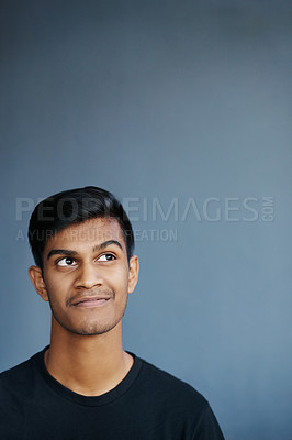 Buy stock photo Thinking, idea and Indian man in studio for problem solving, brainstorming or solution on grey background. Why, planning and gen z student with how to, questions or reflection, memory or conclusion