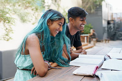 Buy stock photo Happy, students and textbooks on university campus for education, learning and studying together. College, Indian man and woman with books for discussion, collaboration and research for assignment