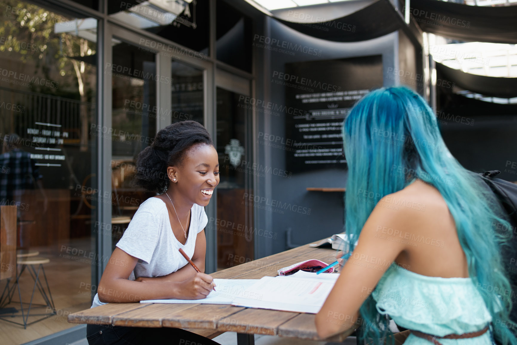 Buy stock photo Happy, students and studying on university campus for education, learning and knowledge. College, woman and friends with books for discussion, collaboration and sharing information on school project