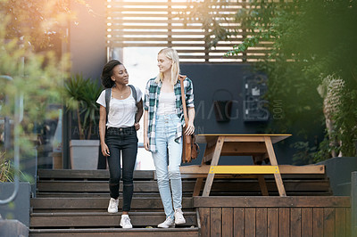 Buy stock photo Walking, conversation and girl students at university planning for study, assignment or test. Networking, discussion and young women with bags bonding and talking by stairs at college campus together