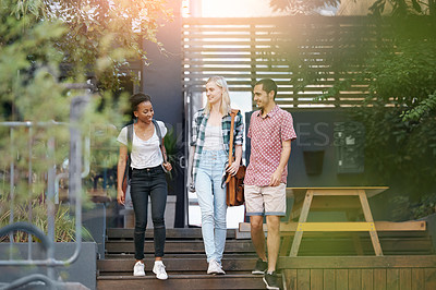 Buy stock photo Walking, conversation and students by stairs at university planning for study, assignment or test. Networking, discussion and young friends with bags bonding and talking by steps at college campus.