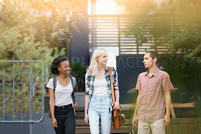 Buy stock photo Walking, discussion and young students at university planning for study, assignment or test. Networking, conversation and young friends with bags bonding and talking at college campus together.