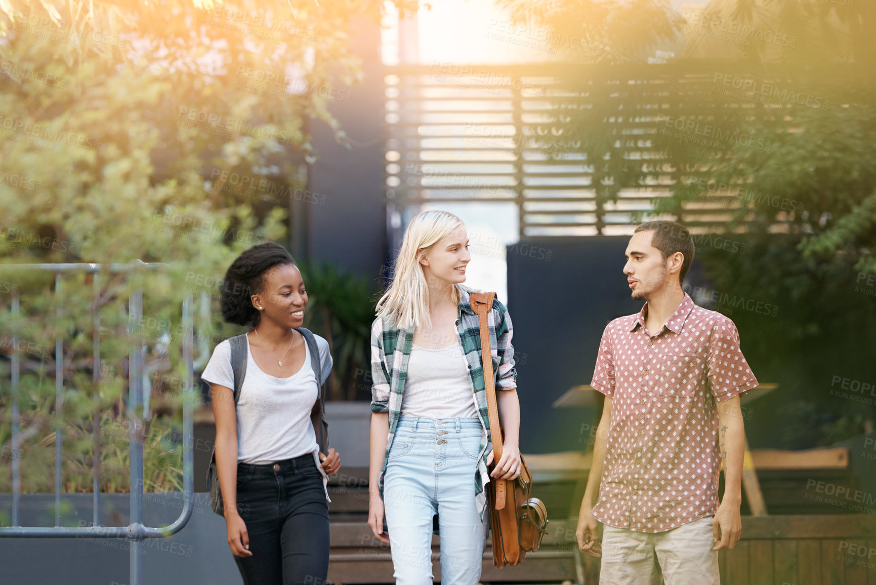 Buy stock photo Walking, discussion and young students at university planning for study, assignment or test. Networking, conversation and young friends with bags bonding and talking at college campus together.