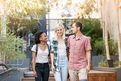 Buy stock photo Walking, education and young students at university planning for study, assignment or test. Scholarship, conversation and young people with bags bonding and talking at college campus together.