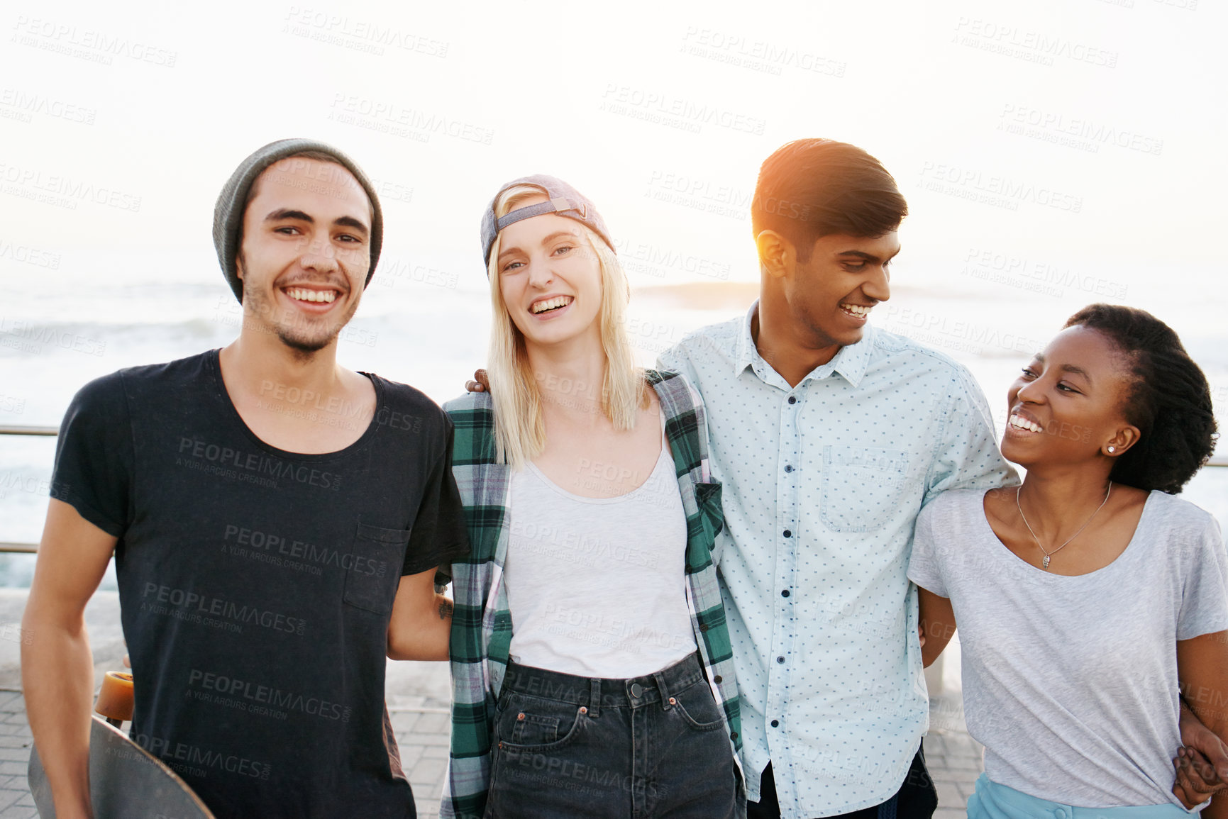 Buy stock photo Date, diversity and smile with holiday at beach in summer or hot weather, together and support. Couple of friends, commitment and bonding for romance with soulmate, care and happy in boardwalk