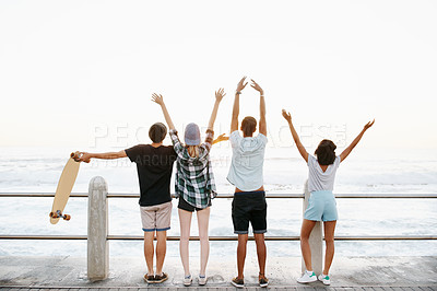 Buy stock photo Freedom, hands and back of friends by ocean for holiday, summer vacation and weekend outdoors. Diversity, promenade and men and women by seaside for travel, adventure and relax together for bonding