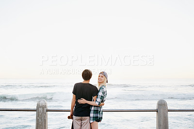 Buy stock photo Couple, skateboard and happy on beach for travel with mockup space, adventure or promenade date. Gen z skater, people and portrait on boardwalk for bonding, embrace and outdoor fun with morning waves