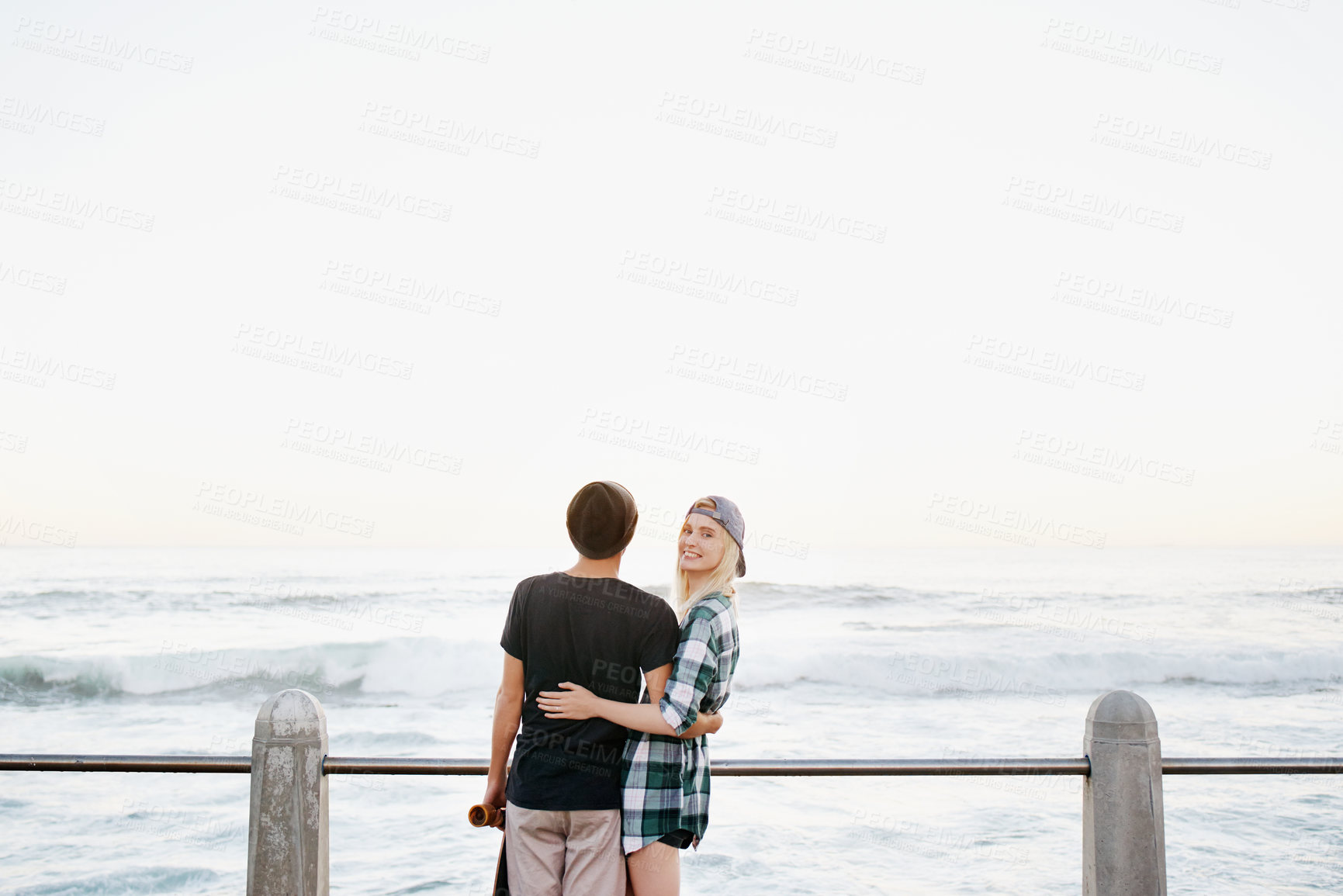 Buy stock photo Couple, skateboard and happy on beach for travel with mockup space, adventure or promenade date. Gen z skater, people and portrait on boardwalk for bonding, embrace and outdoor fun with morning waves