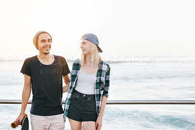 Buy stock photo Couple, skateboard and smile by ocean for fun with mockup space, adventure and promenade date. Gen z skater, people and portrait on boardwalk for bonding, embrace and outdoor travel with beach waves