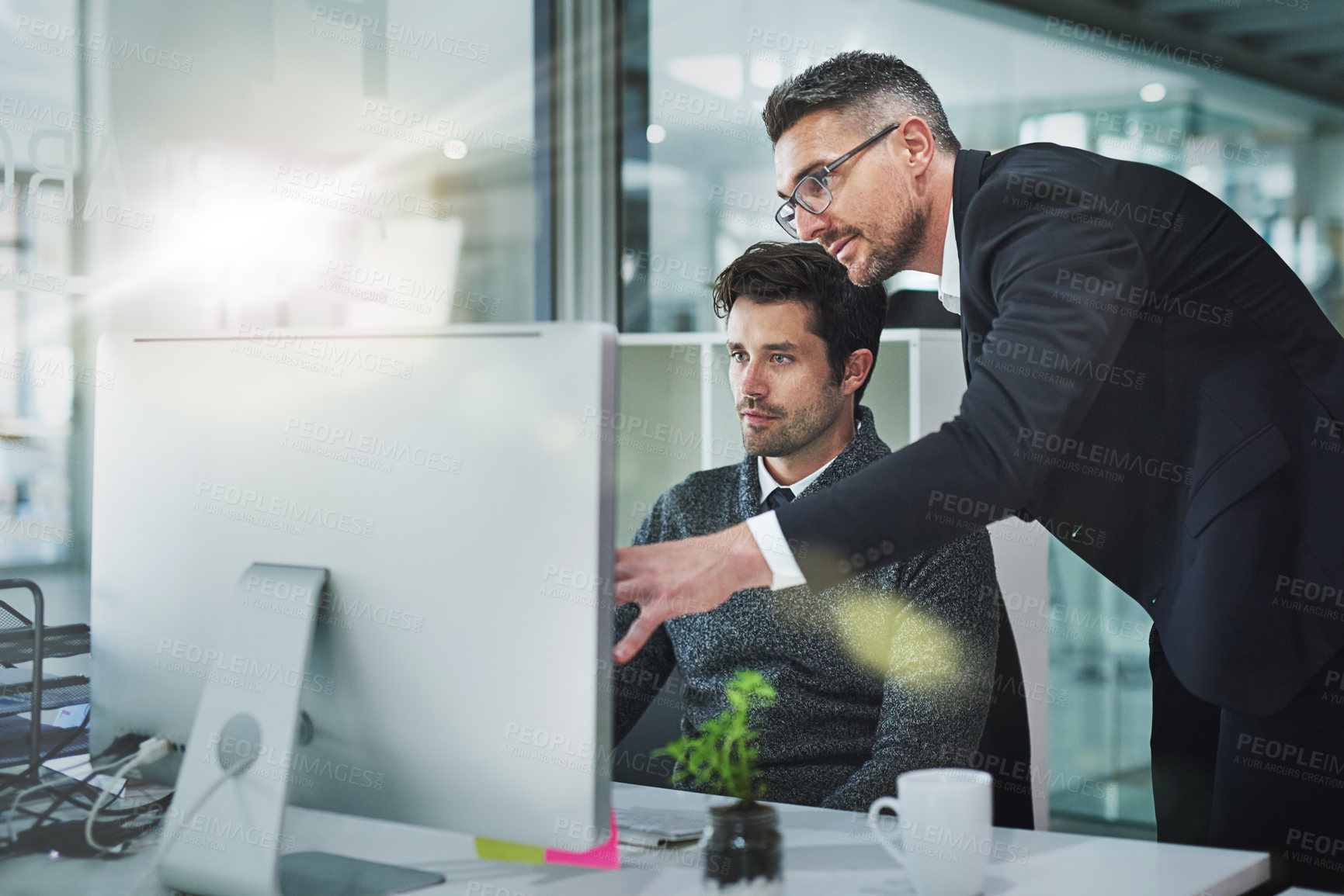 Buy stock photo Shot of corporate colleagues working together in their office