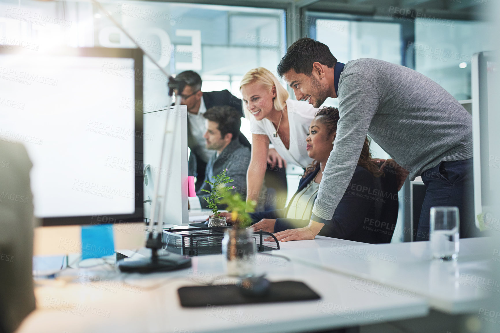 Buy stock photo Shot of corporate colleagues working together in their office