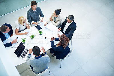 Buy stock photo Top view, business people and staff in a meeting, feedback or conversation for report on a project, discussion or budget planning. Group, men or women with ideas, teamwork or cooperation with support
