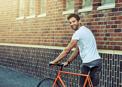 Buy stock photo Travel, bicycle and portrait of man by brick wall in city for sightseeing on vacation or adventure. Smile, walking and male person with bike in town street on weekend trip or holiday in Netherlands.