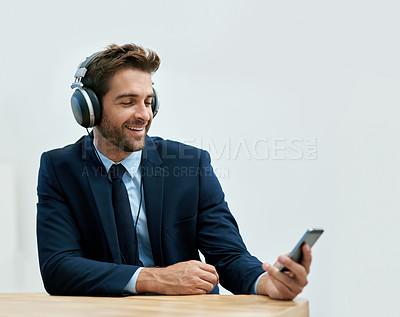 Buy stock photo Headphones, office and businessman with smartphone for social media, browsing internet or streaming music. Smile, mobile phone and male person with headset for watching videos, podcast or online vlog