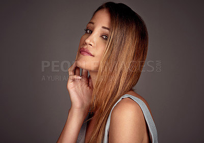 Buy stock photo Portrait, beauty and skincare of woman with hair in studio for health, glow or shine isolated on a gray background. Face, serious and young model in makeup, cosmetics and fashion on mockup space